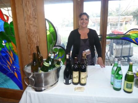 Volunteer Gina Campus serving wine and water to guests