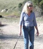 Volcan Volunteer Sheana Fry walking her dog; photo by Taylor Cole